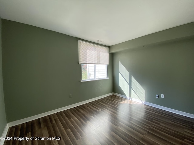 empty room featuring dark hardwood / wood-style floors