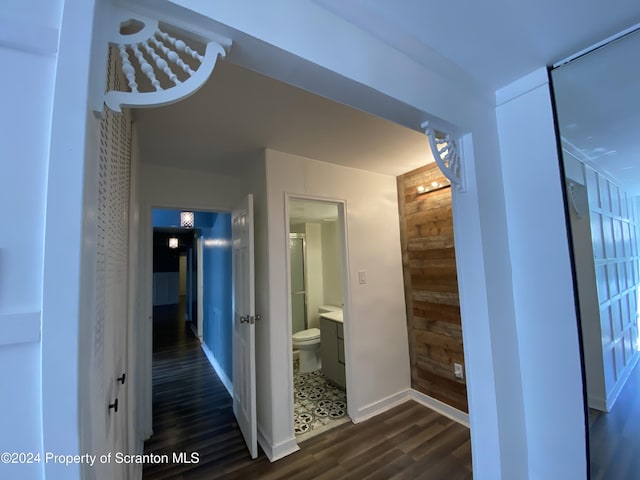 corridor with dark wood-type flooring