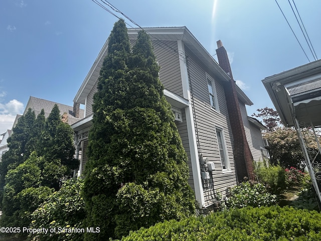 215 S Hyde Park Ave, Scranton, PA 18504 - view of property exterior with a chimney