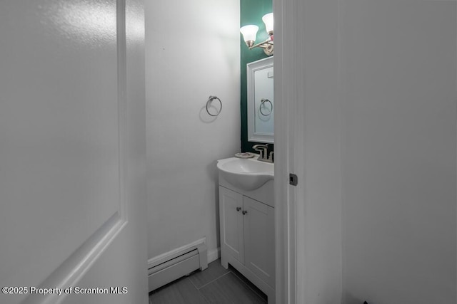 bathroom with a baseboard radiator and vanity