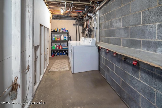 unfinished basement featuring washing machine and dryer