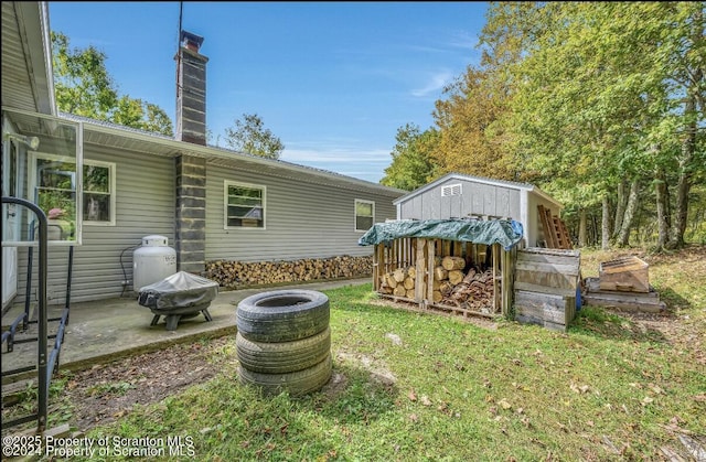 view of yard with a patio area and a fire pit