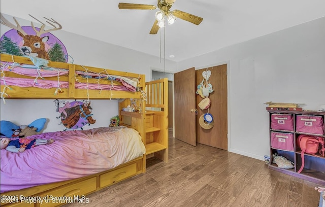 bedroom featuring hardwood / wood-style floors and ceiling fan