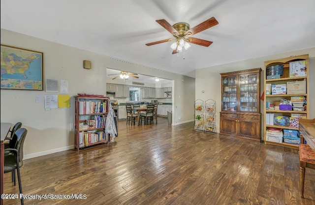 office space featuring dark hardwood / wood-style flooring and ceiling fan