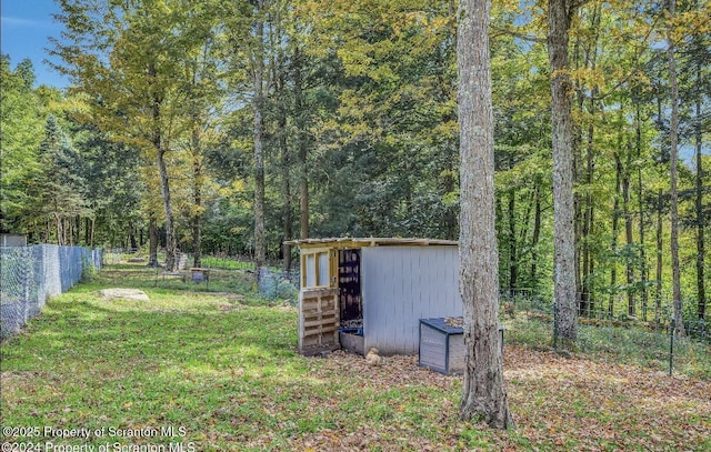 view of outbuilding featuring a lawn