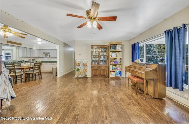 miscellaneous room featuring light hardwood / wood-style floors and ceiling fan