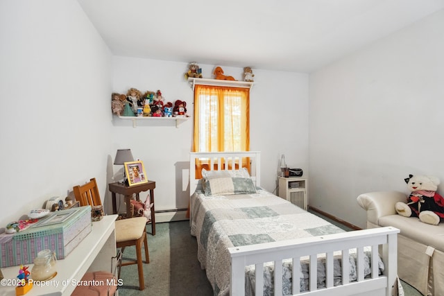 carpeted bedroom with baseboard heating