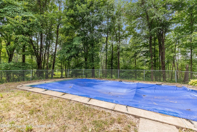 view of swimming pool featuring a fenced backyard and a fenced in pool