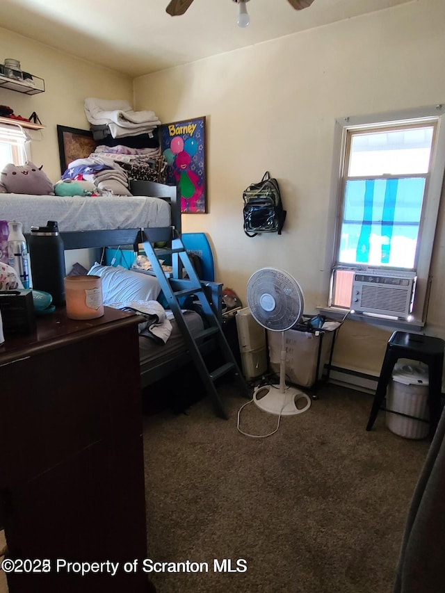 bedroom with cooling unit and carpet floors