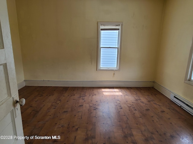 unfurnished room with dark wood-type flooring