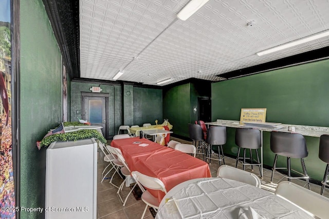 dining area featuring tile patterned flooring