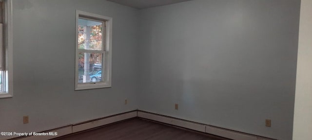 unfurnished room featuring hardwood / wood-style flooring