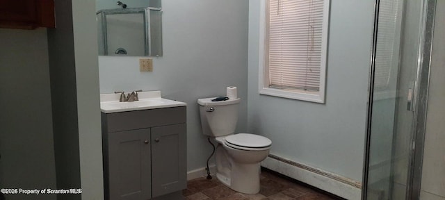 bathroom featuring walk in shower, vanity, toilet, and a baseboard heating unit