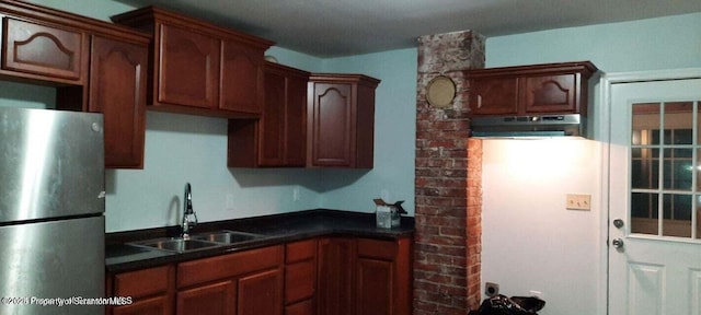 kitchen with sink and stainless steel fridge