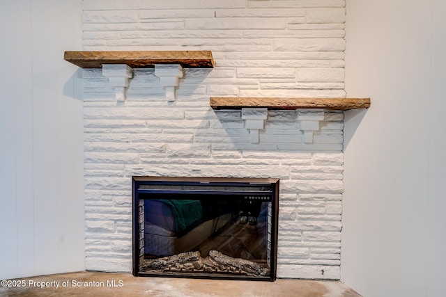 interior details featuring a stone fireplace