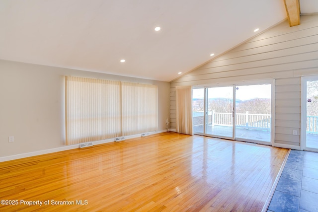 spare room with lofted ceiling with beams, recessed lighting, visible vents, and light wood finished floors