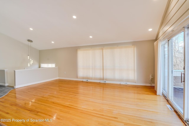 spare room featuring visible vents, recessed lighting, baseboards, and light wood-style floors