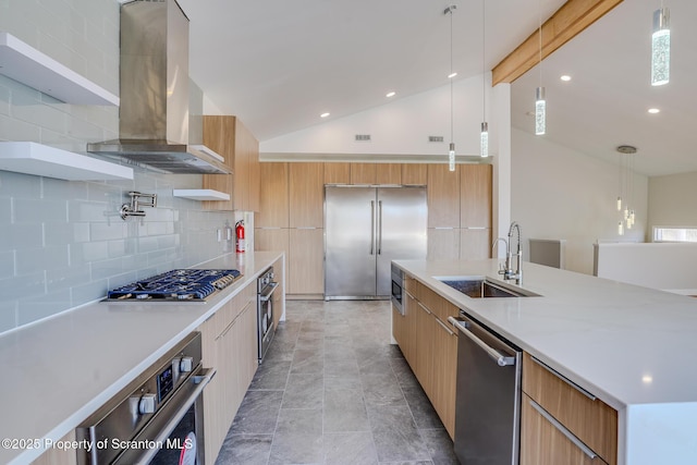 kitchen with island exhaust hood, a sink, vaulted ceiling, appliances with stainless steel finishes, and modern cabinets