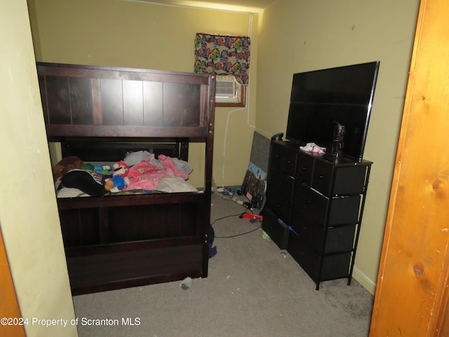 bedroom with light carpet and cooling unit