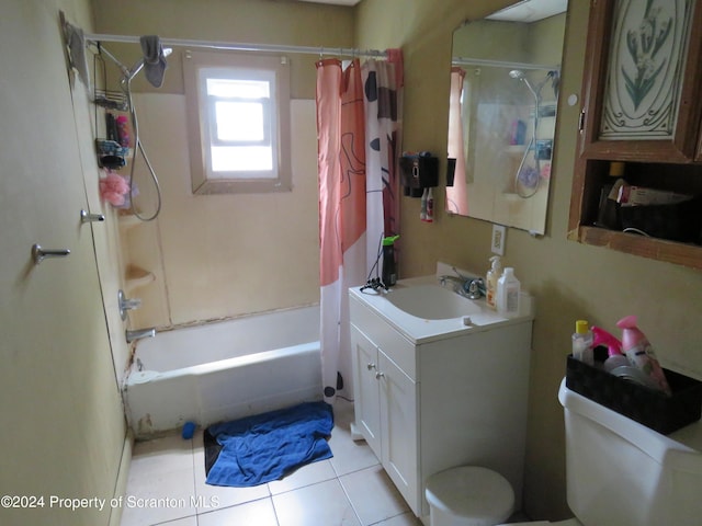 full bathroom featuring toilet, vanity, tile patterned floors, and shower / bathtub combination with curtain