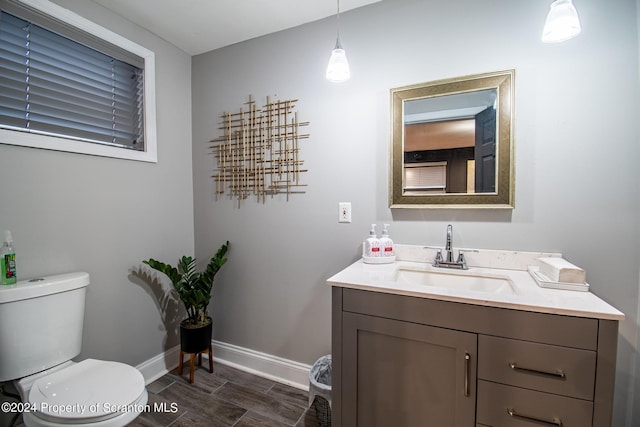 bathroom with vanity and toilet