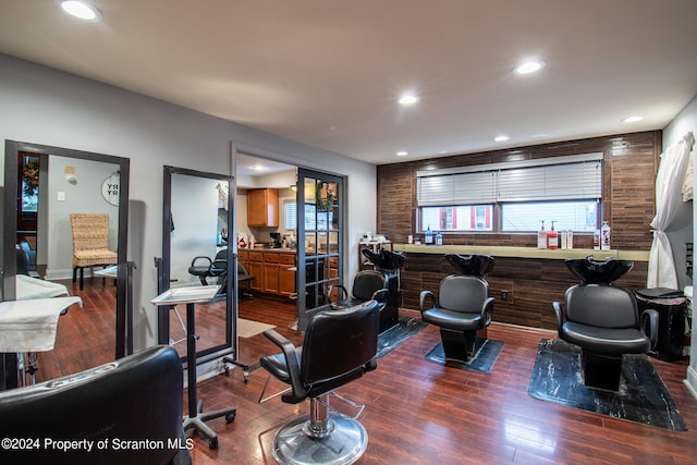 living room featuring bar area and dark wood-type flooring