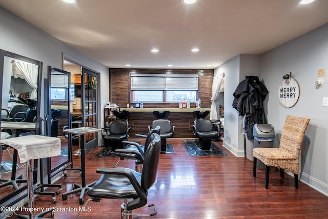 interior space featuring indoor bar and dark hardwood / wood-style flooring