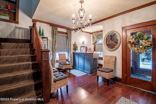 interior space featuring dark hardwood / wood-style floors, an inviting chandelier, and crown molding