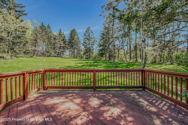 wooden deck with a yard