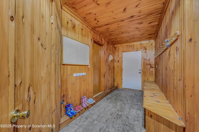 doorway to outside featuring wooden walls, wood ceiling, and tile patterned floors