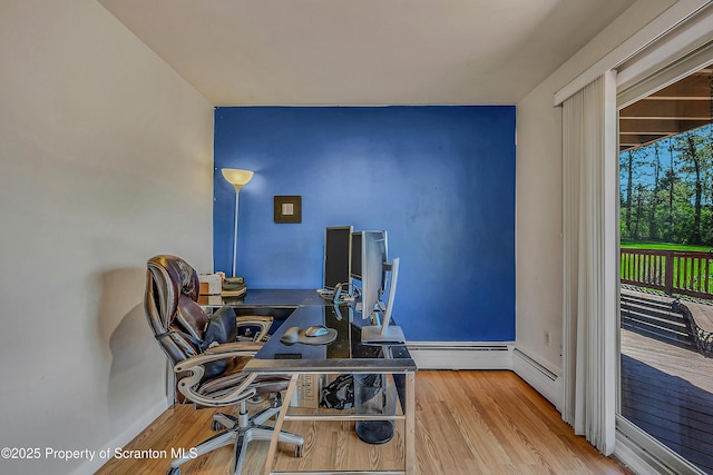 office featuring baseboards and wood finished floors