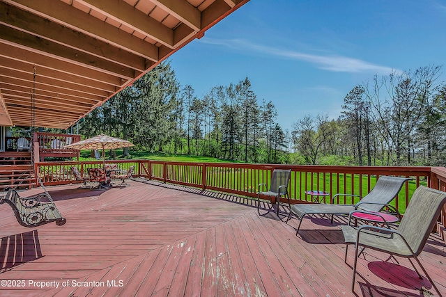 deck featuring a yard