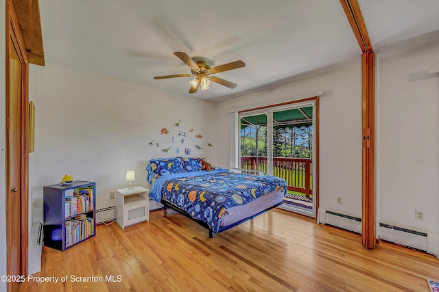 bedroom with access to outside, a ceiling fan, baseboard heating, and light wood finished floors
