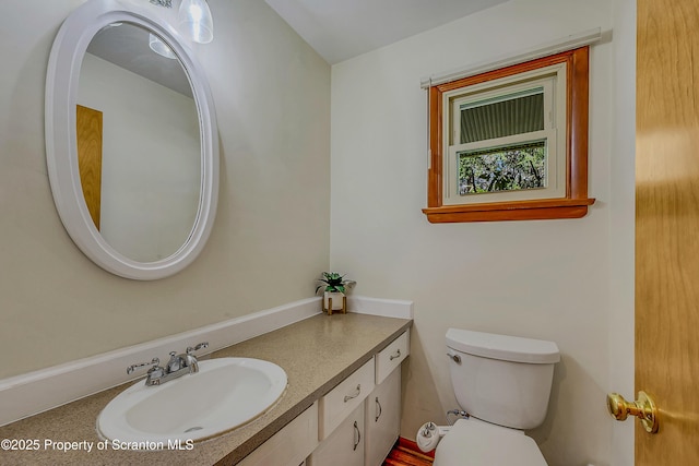 bathroom with vanity and toilet