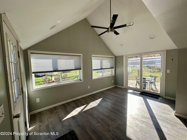 spare room with lofted ceiling, ceiling fan, and dark wood-type flooring