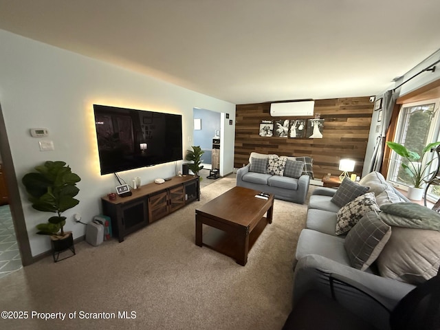 carpeted living room featuring wood walls, an AC wall unit, and an accent wall