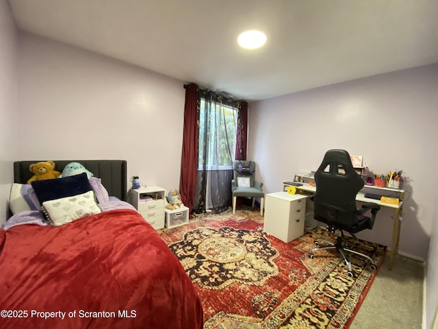 bedroom with light colored carpet