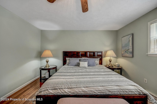 bedroom featuring wood-type flooring and ceiling fan