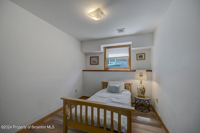 bedroom with light hardwood / wood-style flooring