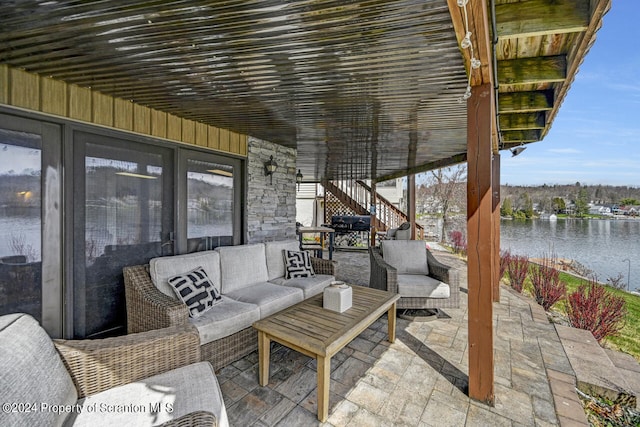 view of patio featuring a water view and an outdoor hangout area