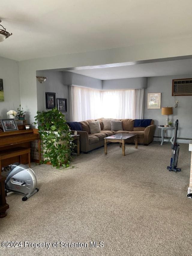 living room with carpet and a wall mounted AC