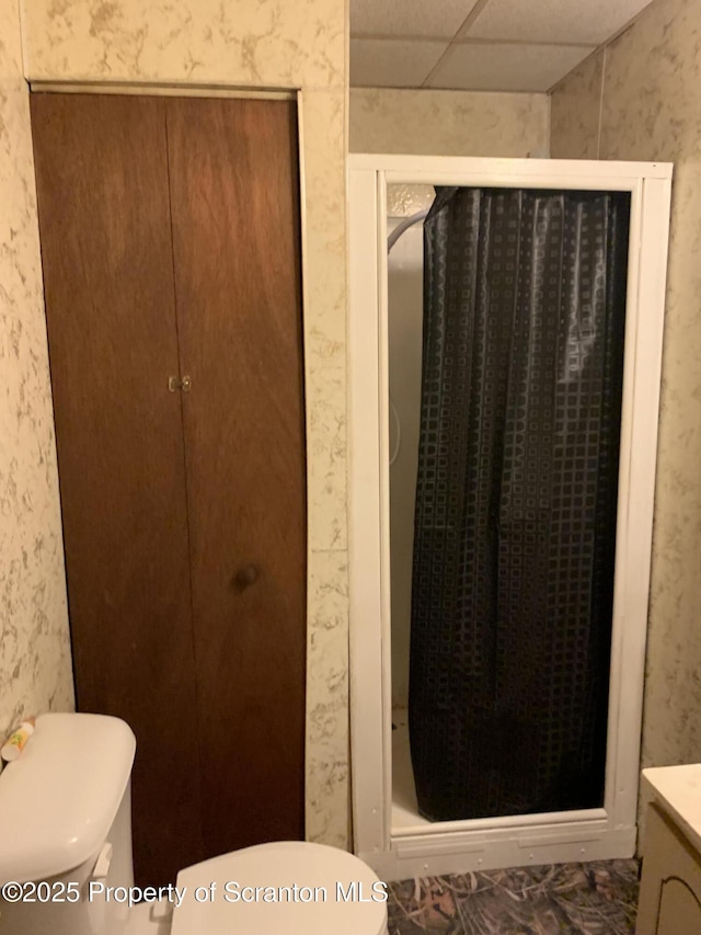 2385 Blewett Rd, Union Dale, PA 18470 - bathroom featuring a stall shower, vanity, a drop ceiling, and wallpapered walls