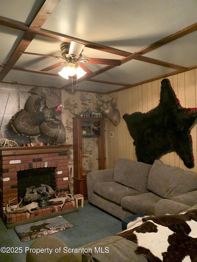 2385 Blewett Rd, Union Dale, PA 18470 - carpeted living room featuring ceiling fan, wooden walls, and a brick fireplace