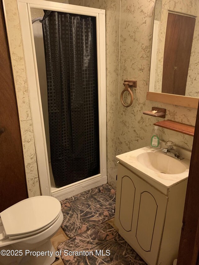 2385 Blewett Rd, Union Dale, PA 18470 - bathroom featuring vanity, wallpapered walls, and a walk in shower