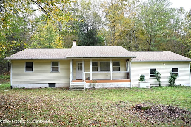 ranch-style home with a front yard