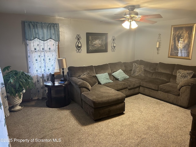 living room with ceiling fan and carpet floors