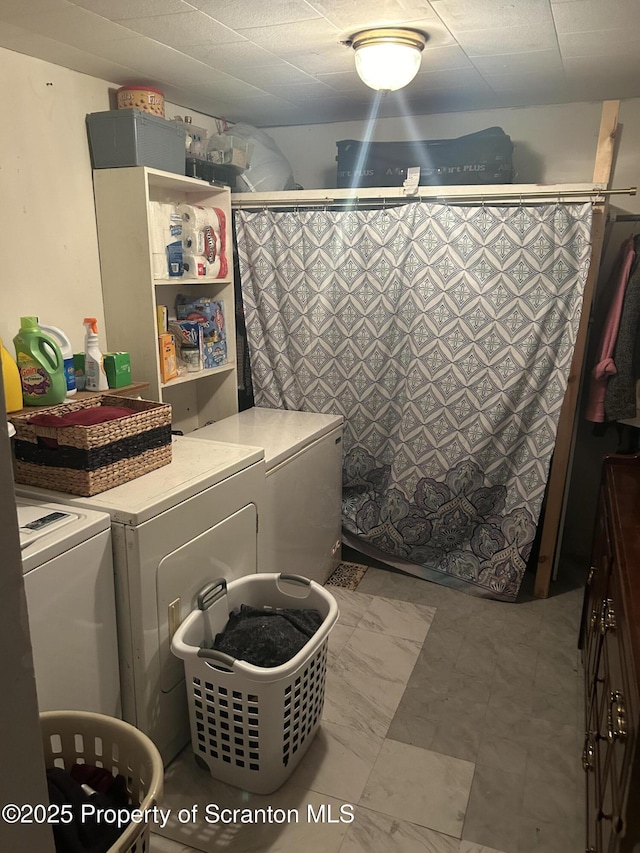 washroom with independent washer and dryer