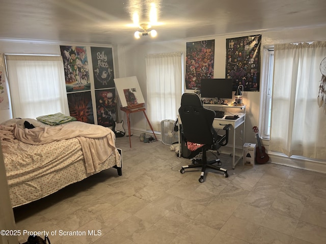 bedroom featuring multiple windows