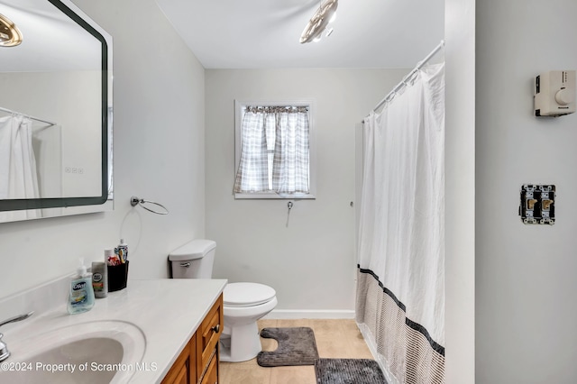 full bathroom with tile patterned flooring, shower / bath combination with curtain, vanity, and toilet