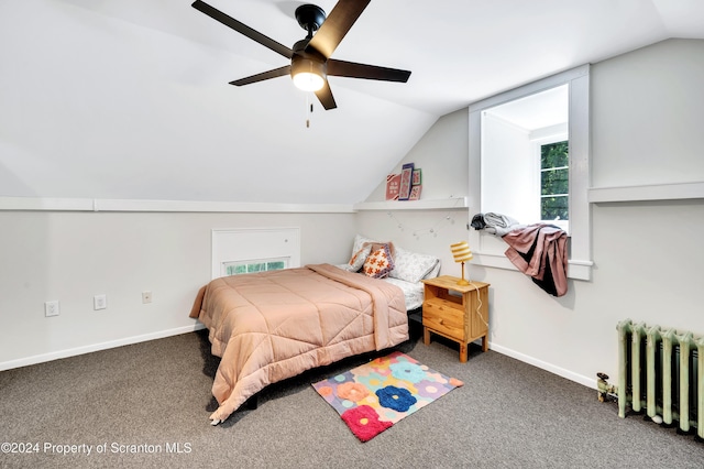 bedroom with carpet flooring, ceiling fan, lofted ceiling, and radiator